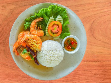 Photo for Stir fried shrimp with tamarind sauce a top view of healthy single dish fast food by jasmine rice and prawn with hot chili - Royalty Free Image