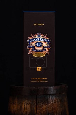 Photo for Chivas Regal 18 is blended from whiskies matured for at least 18 years. Whisky bottle on barrel. Illustrative editorial photo Bucharest, Romania, 2021 - Royalty Free Image