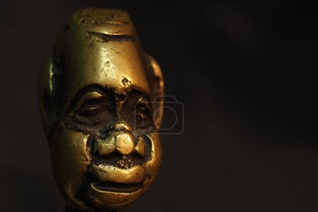 Photo for Bronze figurine, sculpture, head on a black background. - Royalty Free Image