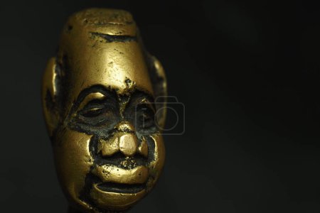 Photo for Bronze figurine, sculpture, head on a black background. - Royalty Free Image