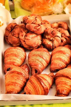 Photo for "Croissants for sale at an eco-friendly flea market" - Royalty Free Image