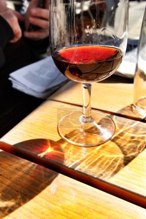 Foto de "Glass of port wine tawny on a table" - Imagen libre de derechos