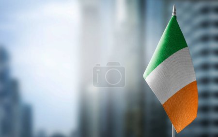 Photo for A small flag of Ireland on the background of a blurred background - Royalty Free Image