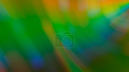 Foto de "Fondo verde borroso abstracto con reflejos de arco iris" - Imagen libre de derechos