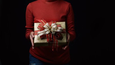 Photo for "Young woman with gift box" - Royalty Free Image