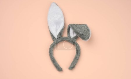 Photo for " rabbit mask on the head with ears on a beige background" - Royalty Free Image