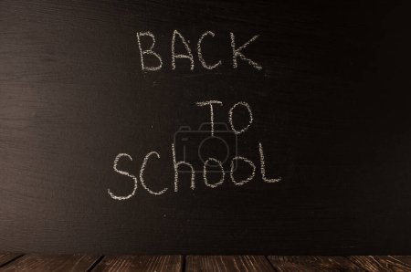 Photo for Back to school, the concept of parenting. The inscription on the blackboard with white chalk. Place for text. Copy space. - Royalty Free Image