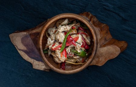 Photo for "Thai Spicy food, Spicy stir fried fish balls and thai herbs vegetables in wooden bowl." - Royalty Free Image