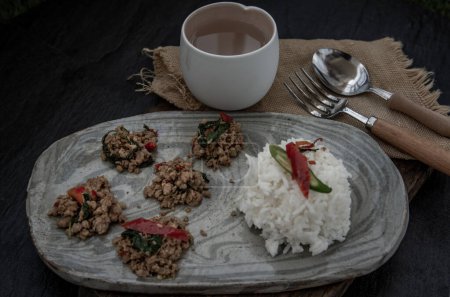 Photo for "Stir fried Thai basil with minced pork and basil served with steamed rice. Popular traditional food of Thailand. look delicious." - Royalty Free Image