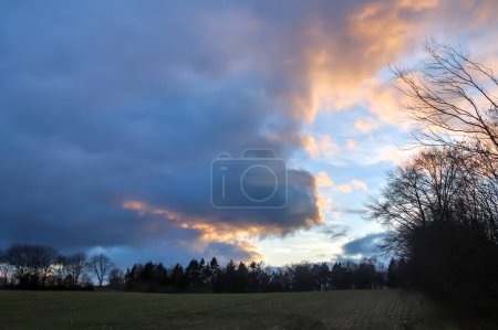 Photo for "Beautiful panorama of orange and yellow clouds at sunrise" - Royalty Free Image