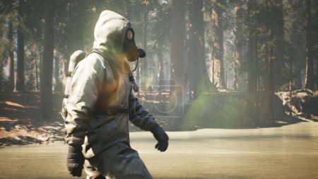 Photo for "A Stalker in a chemical protection suit and a gas mask walks through a summer Sunny forest. The concept of a post-apocalyptic world after a pandemic. 3D Rendering." - Royalty Free Image