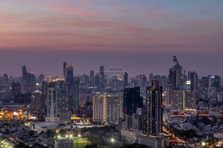 Photo for "Sky view of Bangkok with skyscrapers in the business district in Bangkok in the evening beautiful twilight give the city a modern style." - Royalty Free Image