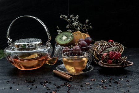 Photo for "Glass of freshly brewed fruit and herbal tea." - Royalty Free Image