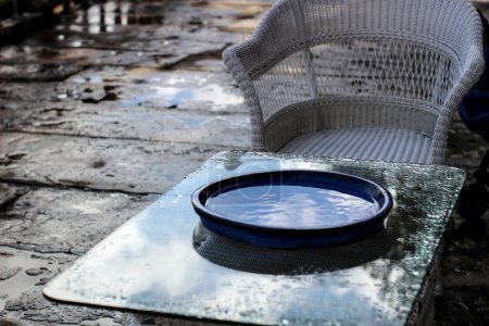Photo for Garden furniture wet by the autumn rain - Royalty Free Image