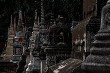 Photo for "Pagodas, Called chedi containing the ashes of members of the thailand people family, in a Buddhist temple, Buddhist bone ash." - Royalty Free Image
