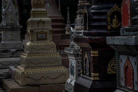 Photo for "Pagodas, Called chedi containing the ashes of members of the thailand people family, in a Buddhist temple, Buddhist bone ash." - Royalty Free Image