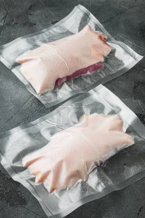 Téléchargez les photos : "Duck breast, raw freshly slaughtered by the bio farm prepared for vacuuming and smoking, on gray stone background" - en image libre de droit