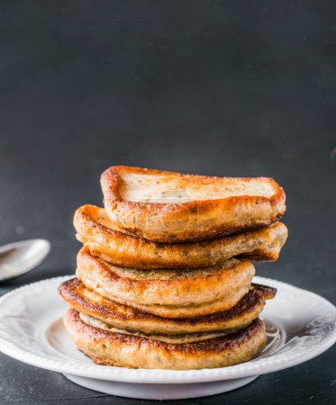 Photo for "stack of pancakes with chia seeds on black" - Royalty Free Image