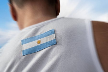 Photo for "The national flag of Argentina on the athlete's back" - Royalty Free Image