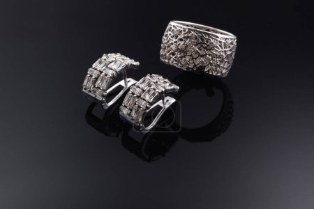 Photo for "Bijouterie and jewelry on a dark background. Rings, bracelets and pendants." - Royalty Free Image