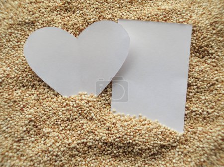 Photo for "closeup of Heart shape on Raw cous cous semolina " - Royalty Free Image