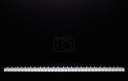Photo for "The silhouette of grand piano in the dark room. " - Royalty Free Image