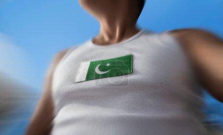 Téléchargez les photos : "Le drapeau national du Pakistan sur la poitrine de l'athlète" - en image libre de droit