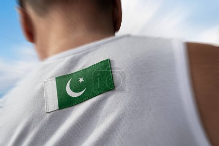 Photo for "The national flag of Pakistan on the athlete's back" - Royalty Free Image