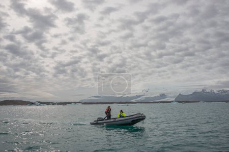 Photo for Touristic activity in Glacier Lagoon Jokulsarlon with icebergs in Iceland, summer - Royalty Free Image