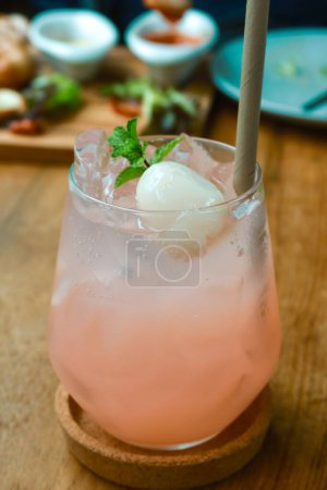 Photo for Closeup lychee soda on wood table - Royalty Free Image