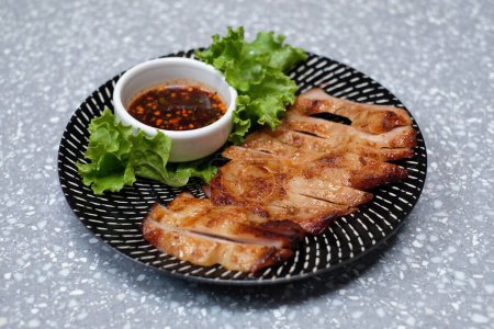 Photo for Pork grilled on marble table - Royalty Free Image