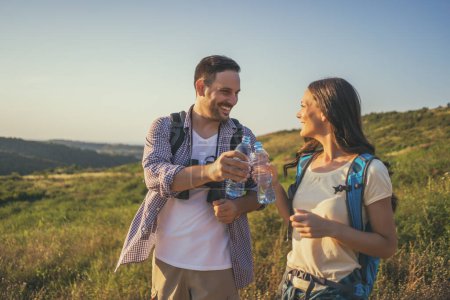 Photo for Young couple hiking together - Royalty Free Image
