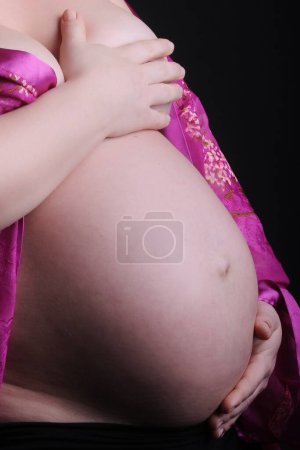 Photo for Pregnant woman belly shooting studio - Royalty Free Image