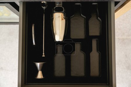 Photo for Bartender tools in wooden boxes. shaker and tableware in the drawer. Bartender equipment. - Royalty Free Image