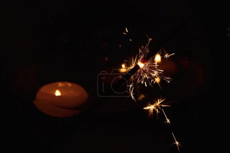 Photo for Sparkler Bokeh Colorful sparkler. Night background with candle. - Royalty Free Image
