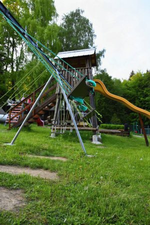 Photo for "Swings playground. A place for children to play outdoors." - Royalty Free Image