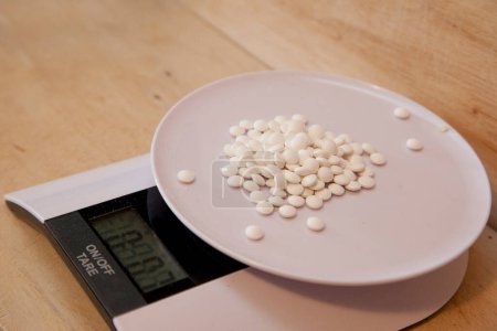 Photo for Pills on a scales, close up - Royalty Free Image