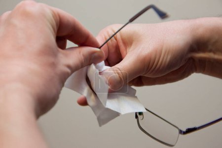 Photo for The Hands cleaning glasses - Royalty Free Image