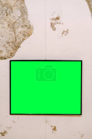Photo for Empty horizontal painting in black frame on mixed wall - Royalty Free Image
