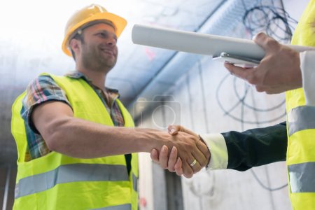 Photo for Handshake on the construction site - Royalty Free Image