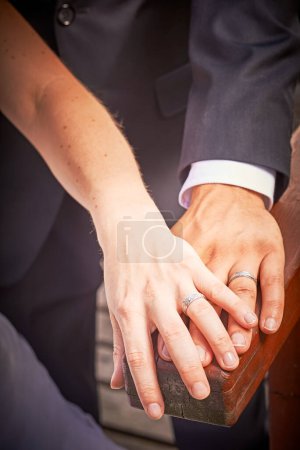 Photo for Newlyweds hands with rings on background, close up - Royalty Free Image