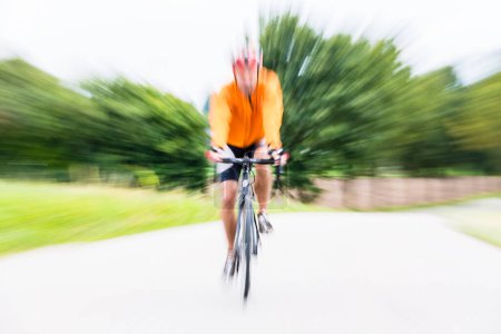 Photo for "Fast Sport Bicyclist on bike with motion blur" - Royalty Free Image