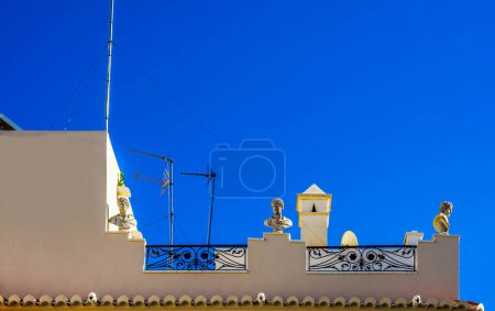Foto de "Stylish balcony with a metal railing, solid architectural element, a place of rest and relaxation" - Imagen libre de derechos