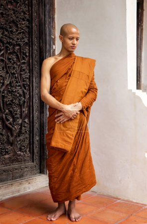 Photo for "Buddhist monks at Wat Mahathat temple, Sukhothai" - Royalty Free Image