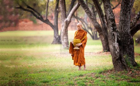 Photo for "Buddhist monks at Wat Mahathat temple, Sukhothai" - Royalty Free Image