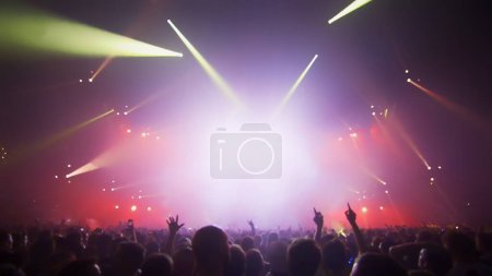 Photo for Concert Music festival and Celebrate. Party People Rock Concert. Crowd Happy and Joyful and Applauding or Clapping. Celebration party festival happiness. Blurry night club. Concert Show with DJ Music festival EDM on Stage - Royalty Free Image