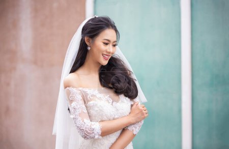 Photo for Portrait of young asian woman in wedding dress - Royalty Free Image