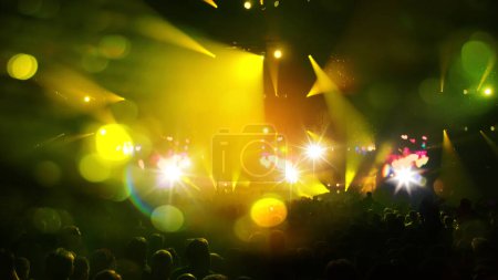 Photo for "Concert Music festival and Celebrate. Party People Rock Concert. Crowd Happy and Joyful and Applauding or Clapping. Celebration party festival happiness. Blurry night club. Concert Show with DJ Music festival EDM on Stage" - Royalty Free Image