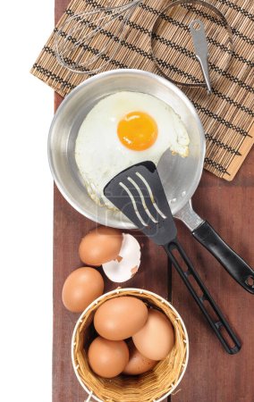 Photo for Top view of cooking Eggs on wooden surface - Royalty Free Image