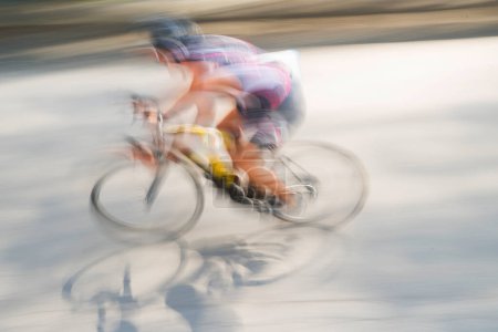 Photo for Blurred view of person racing bicycle - Royalty Free Image